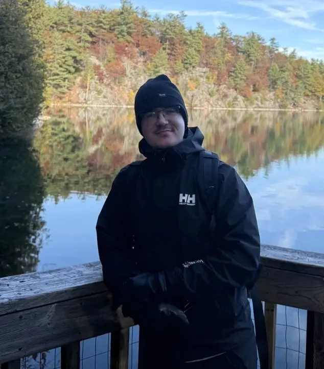 Thomas, founder of Le Petit Roast, outdoors in Quebec autumn
